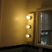 39 A completely rebuilt 1920 light fixture next to the mirror in the second floor bathroom