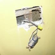 12 An outlet hanging out of the wall in the kitchen without a box-Very dangerous