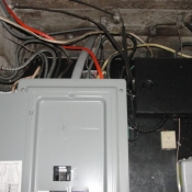 14 The electrical panel in the basement. Notice the black box with all the knob and tube wires going to it